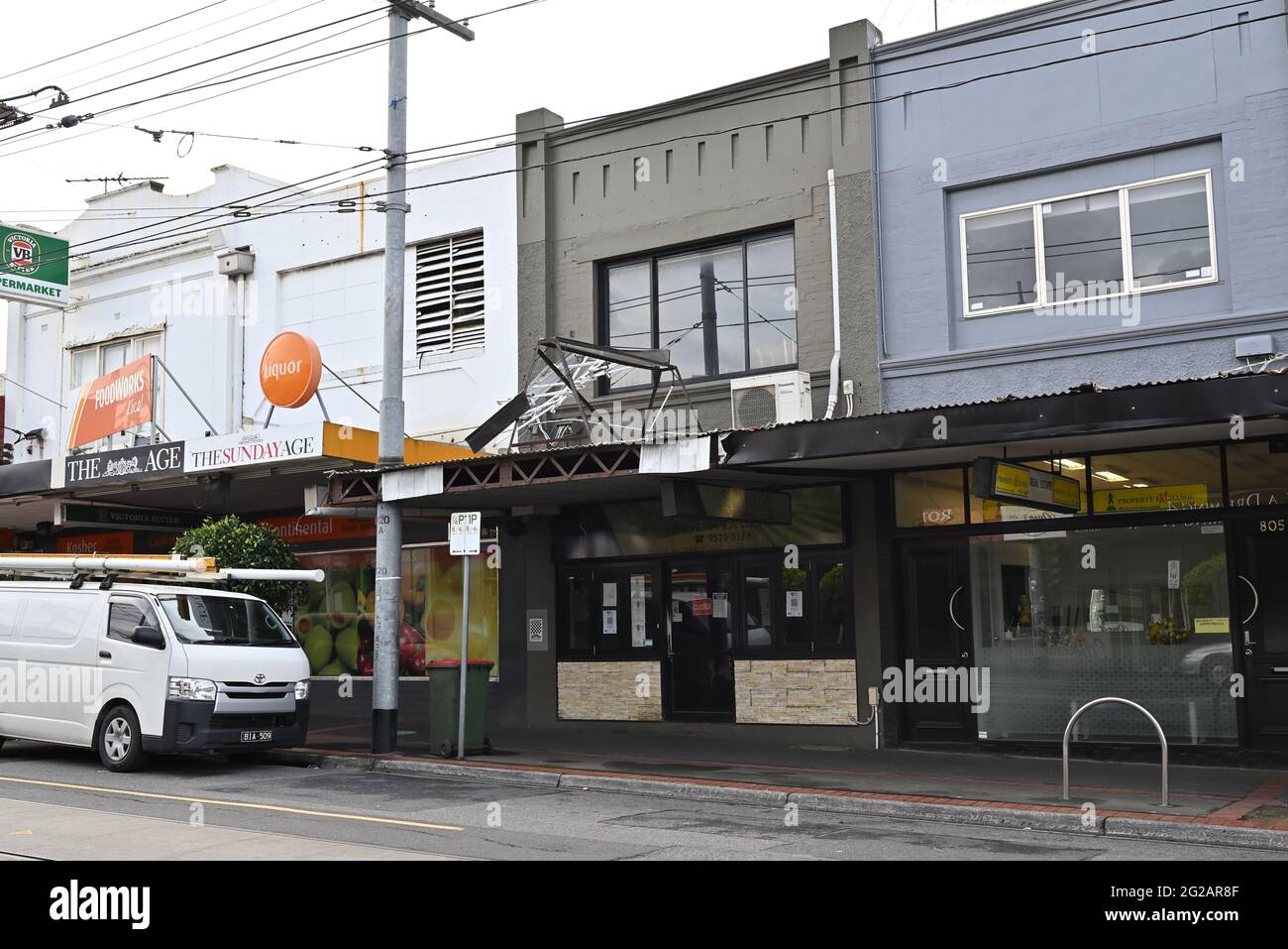 A mangled sign above a Vietnamese restaurant on Glen Huntly Rd