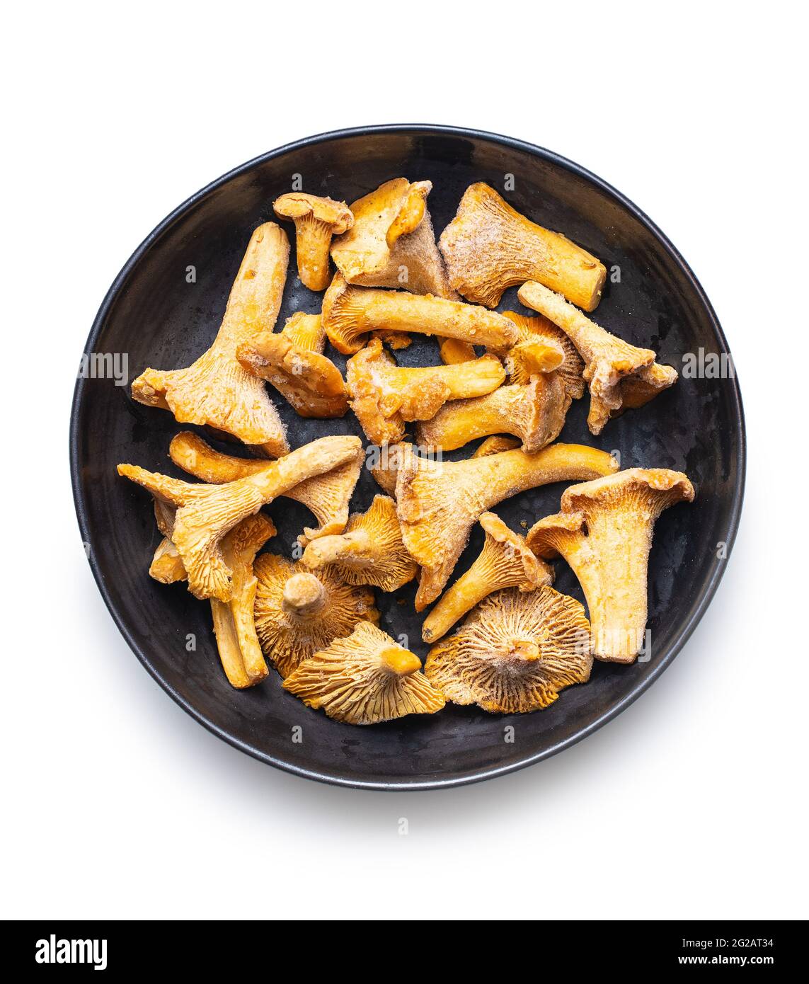 Frozen chanterelle mushrooms isolated on white background. Stock Photo