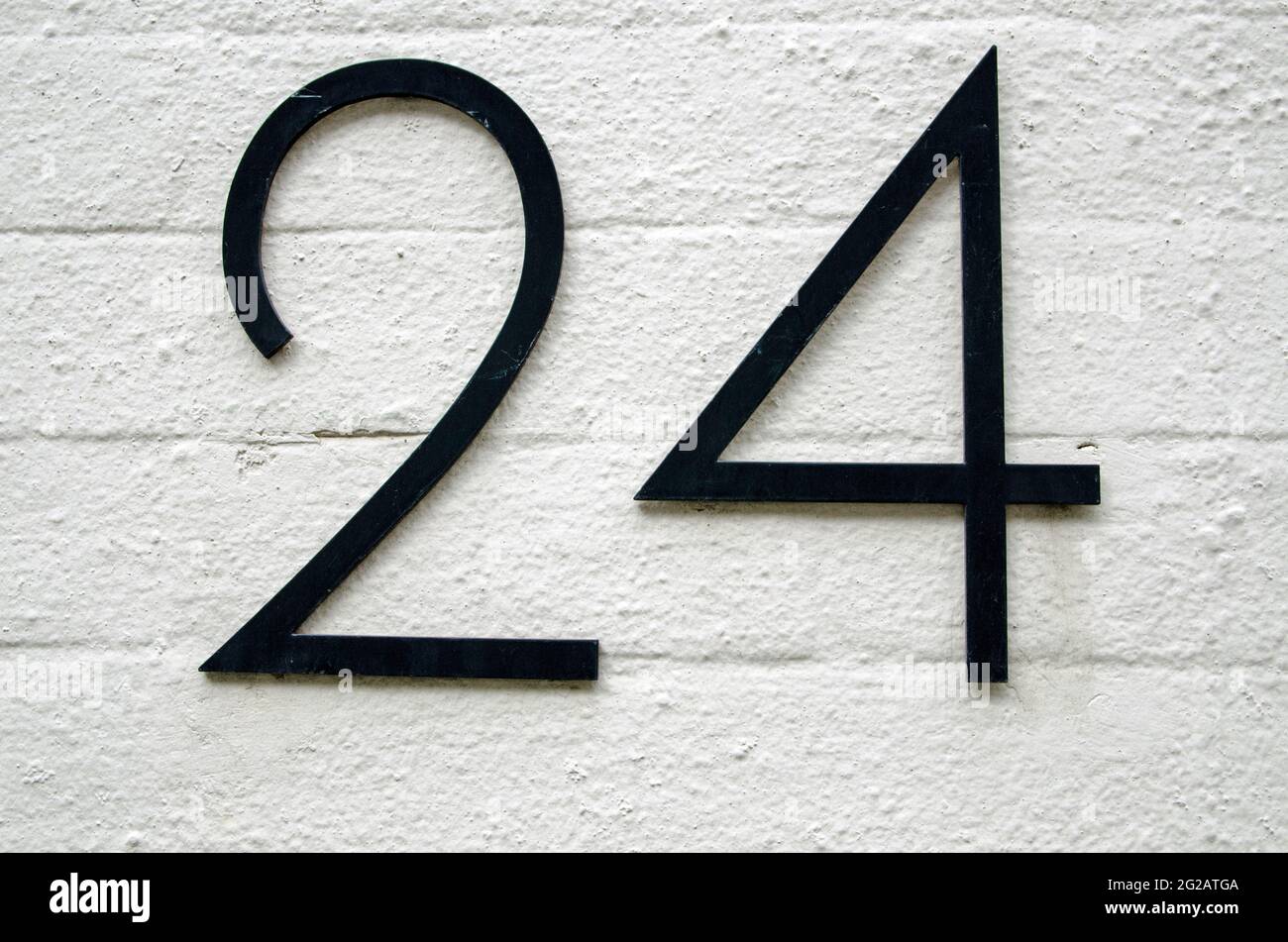 Black figures for the number twenty four on a wall outside an