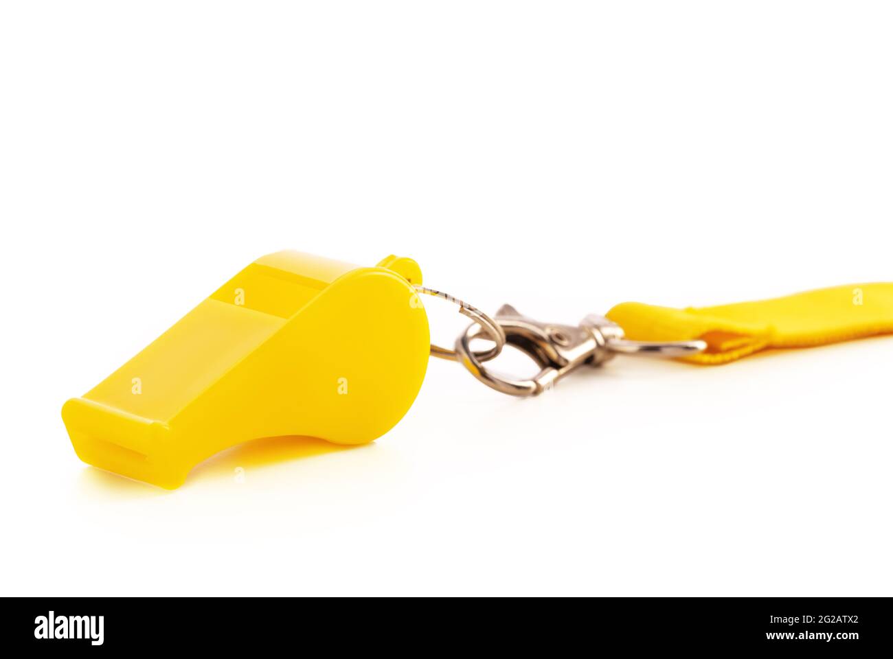 Yellow sport whistle isolated on white background Stock Photo - Alamy