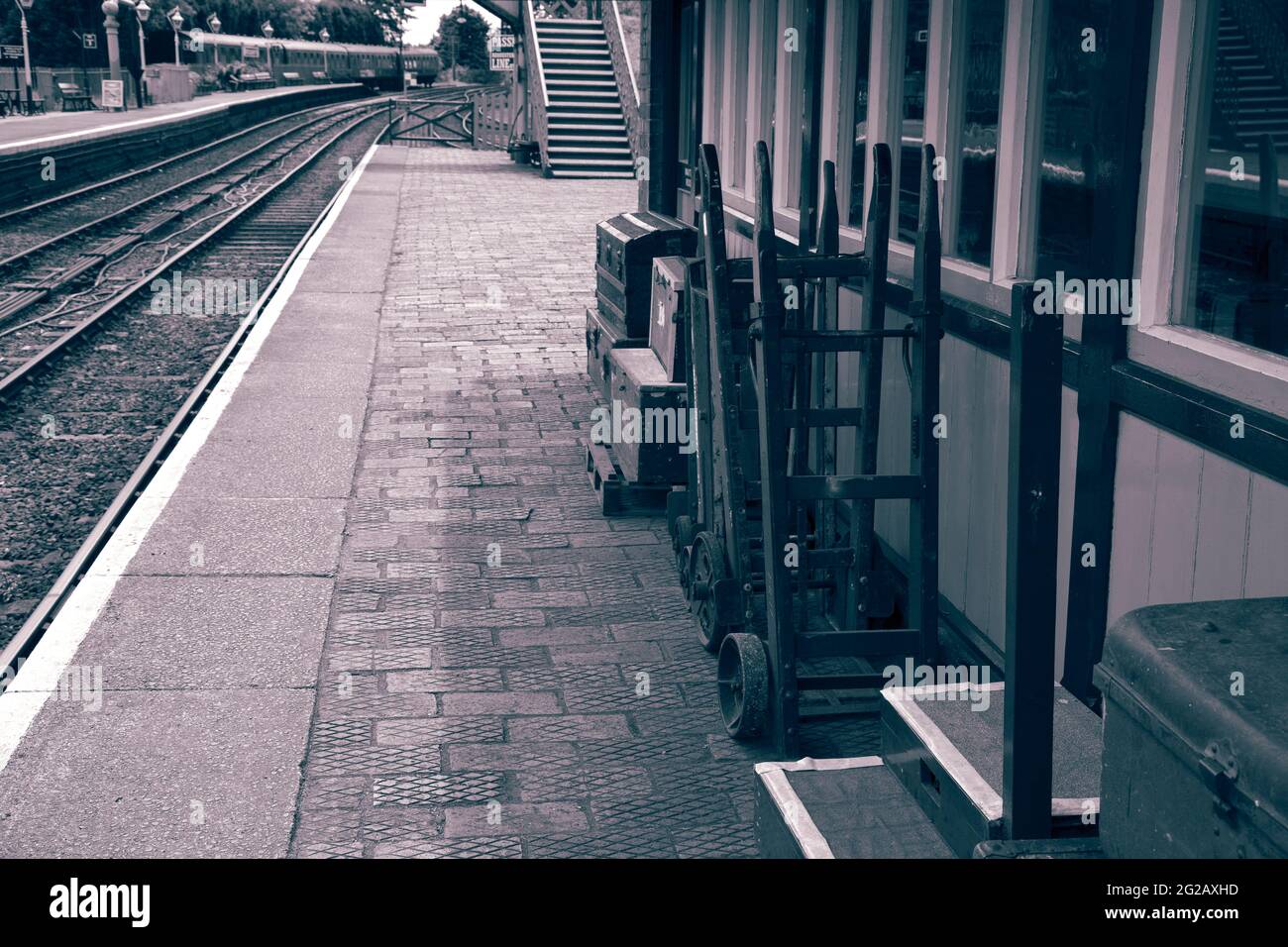 Vintage luggage trolleys and suitcases outside the waiting room of an
