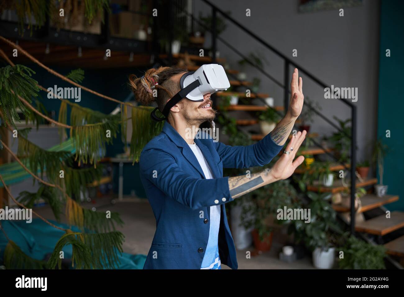 Stylish young man wearing virtual reality glasses Stock Photo - Alamy