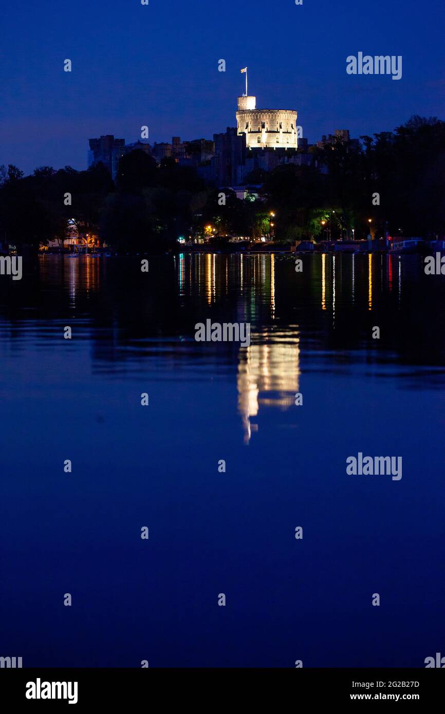 Windsor castle at night from the River Thames Stock Photo