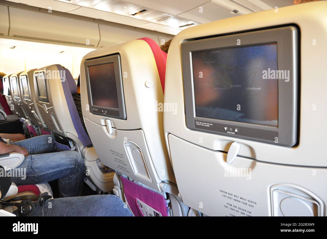 Airplane seats with entertainment on board Stock Photo