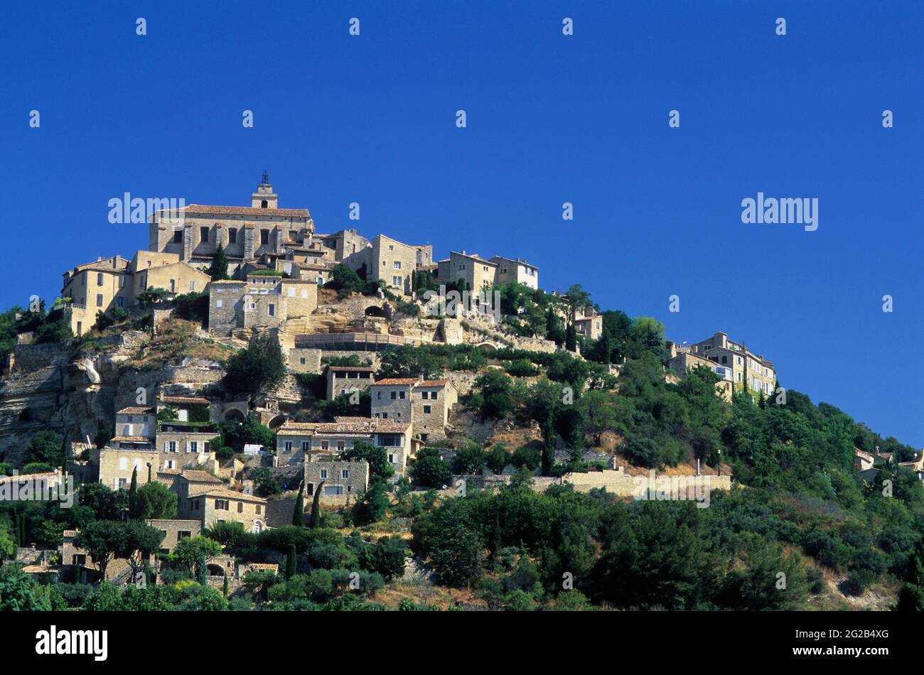 FRANCE,  GORDES ( 84 ) , NATIONAL PARK OF LUBERON, THE CHURCH AT THE TOP OF THE VILLAGE Stock Photo