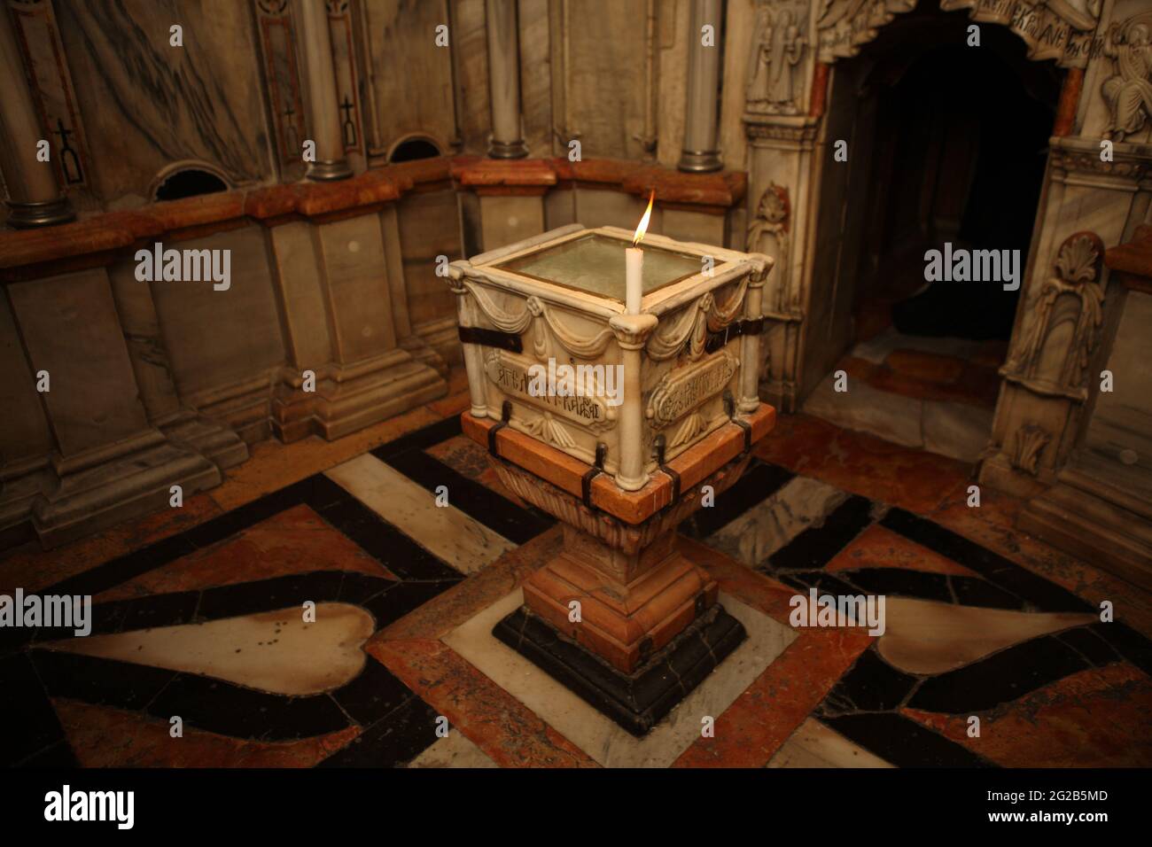 Angel's Stone in the Holy Grave Aedicule, an Altar on which Angel Gabriel sat as he told Virgin Mary and Mary Magdalene Jesus Christ had resurrected. Stock Photo