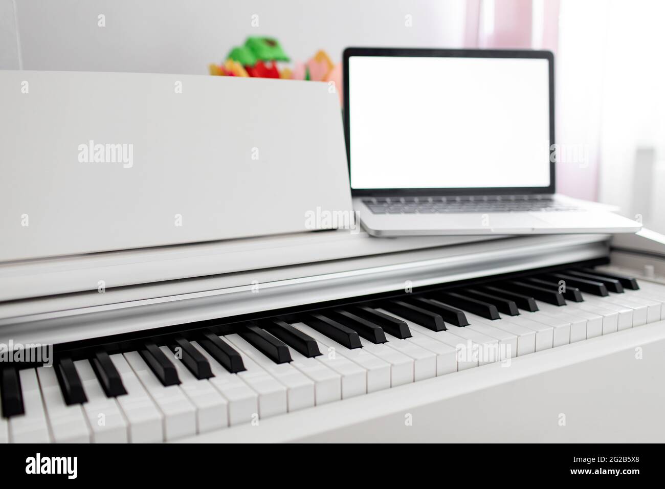 teacher make online piano lesson to teach students pupils learn from home Stock Photo