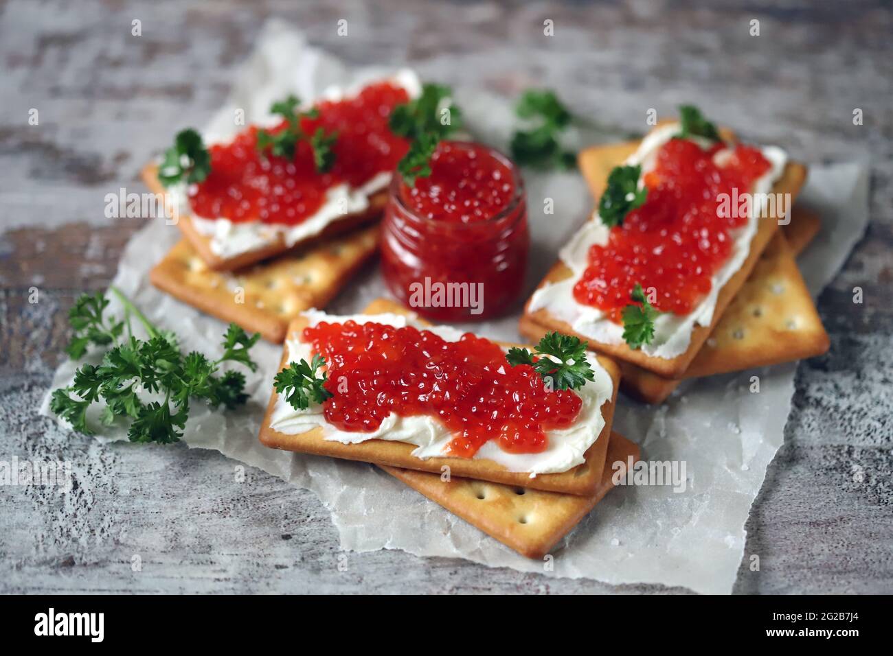Crackers with red caviar. Healthy snack Stock Photo Alamy