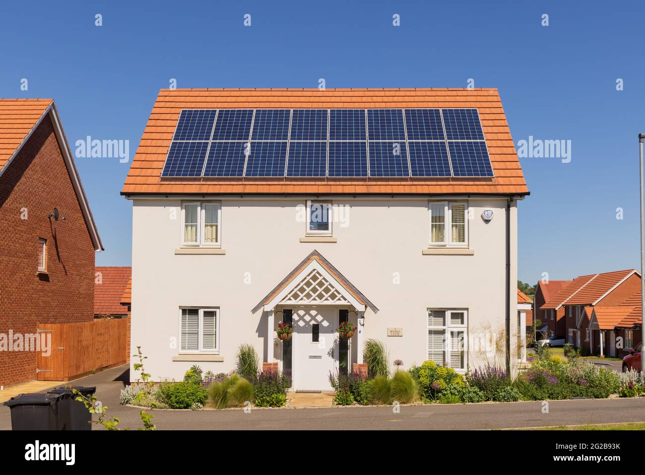 Detached new build home with solar panels on the roof. UK Stock Photo