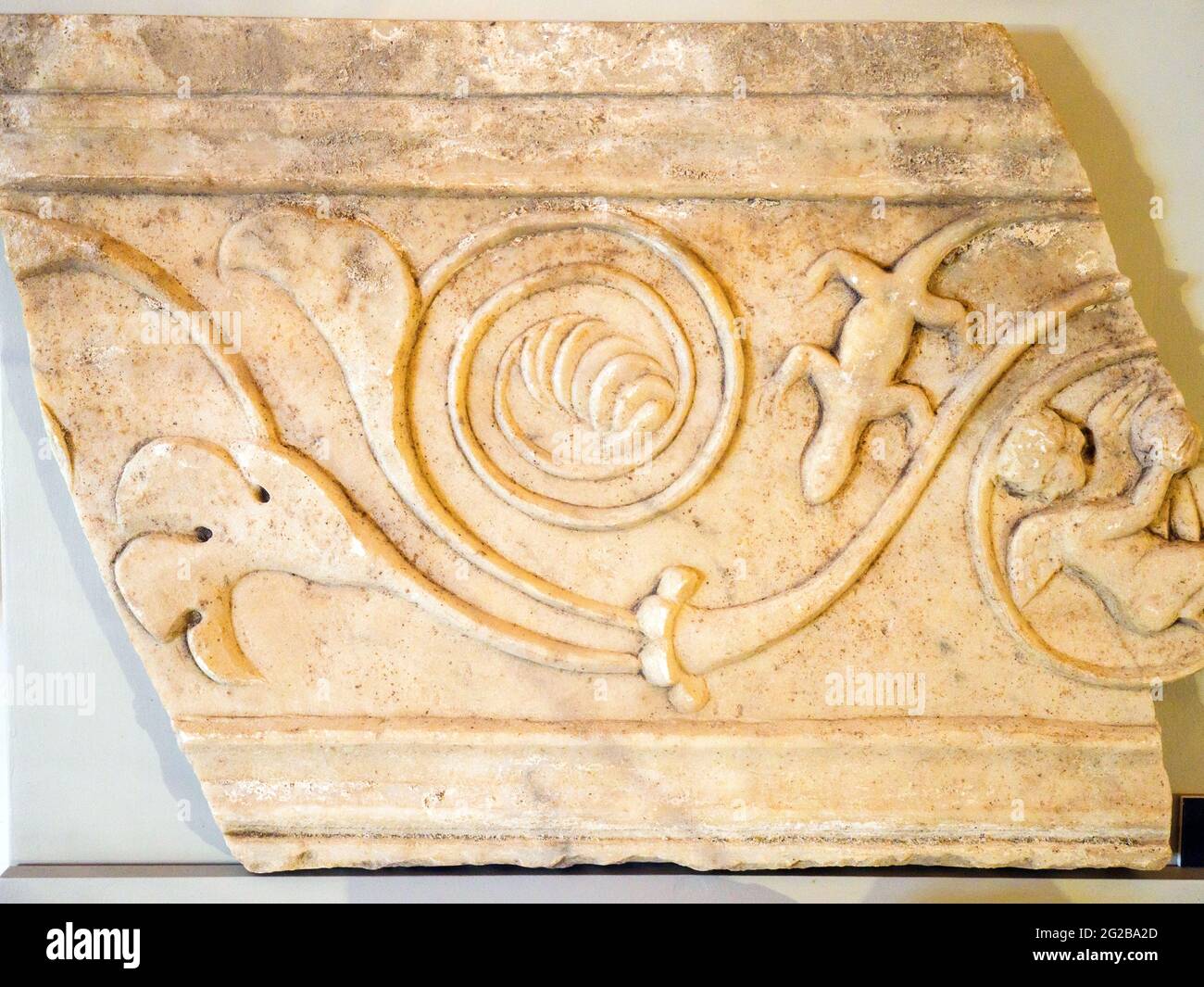 Fragment of a marble plate decorated with plant shoots, Erote and lizard - Oplontis known as Villa Poppaea in Torre Annunziata - Naples, Italy Stock Photo