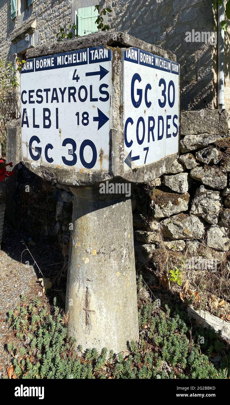 Old Michelin kilometre marker. Road signage “borne d'angle”, two layers of  enamel on lava rock mounted on reinforced concrete. This road marker was cr  Stock Photo - Alamy