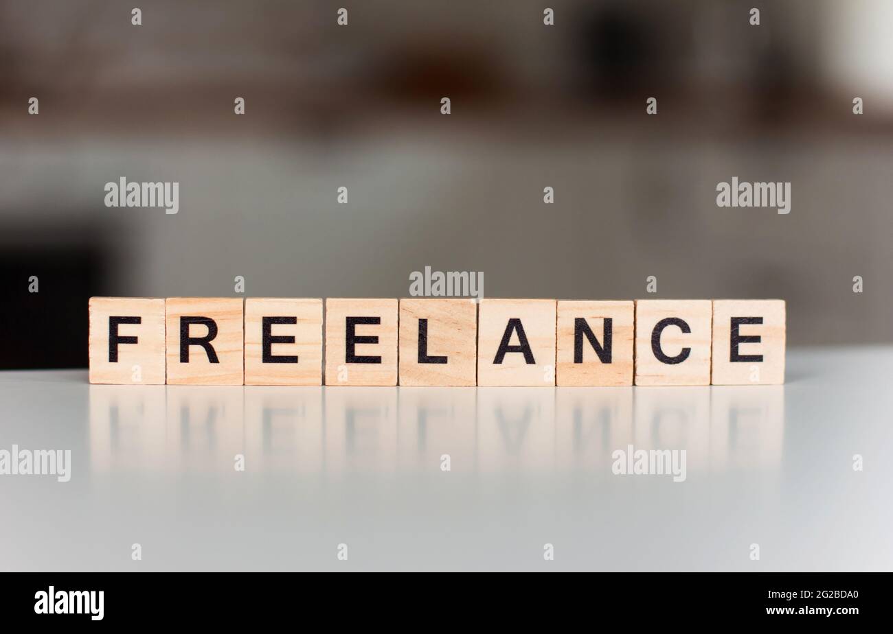 word freelance Wooden blocks with lettering on the background of the ...