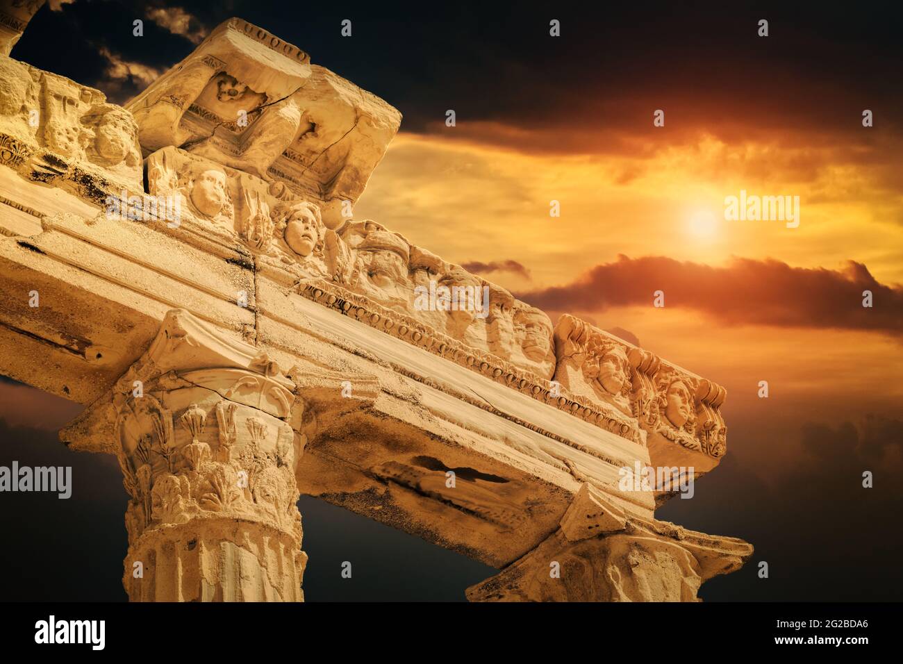Very high detailed closeup photo of faces and columns of beautiful Apollon Temple in the ruins of Side Antique city during sunset, Antalya-Turkey. Stock Photo