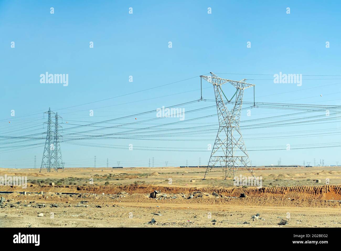 High voltage transmission towers in the desert of egypt Stock Photo Alamy