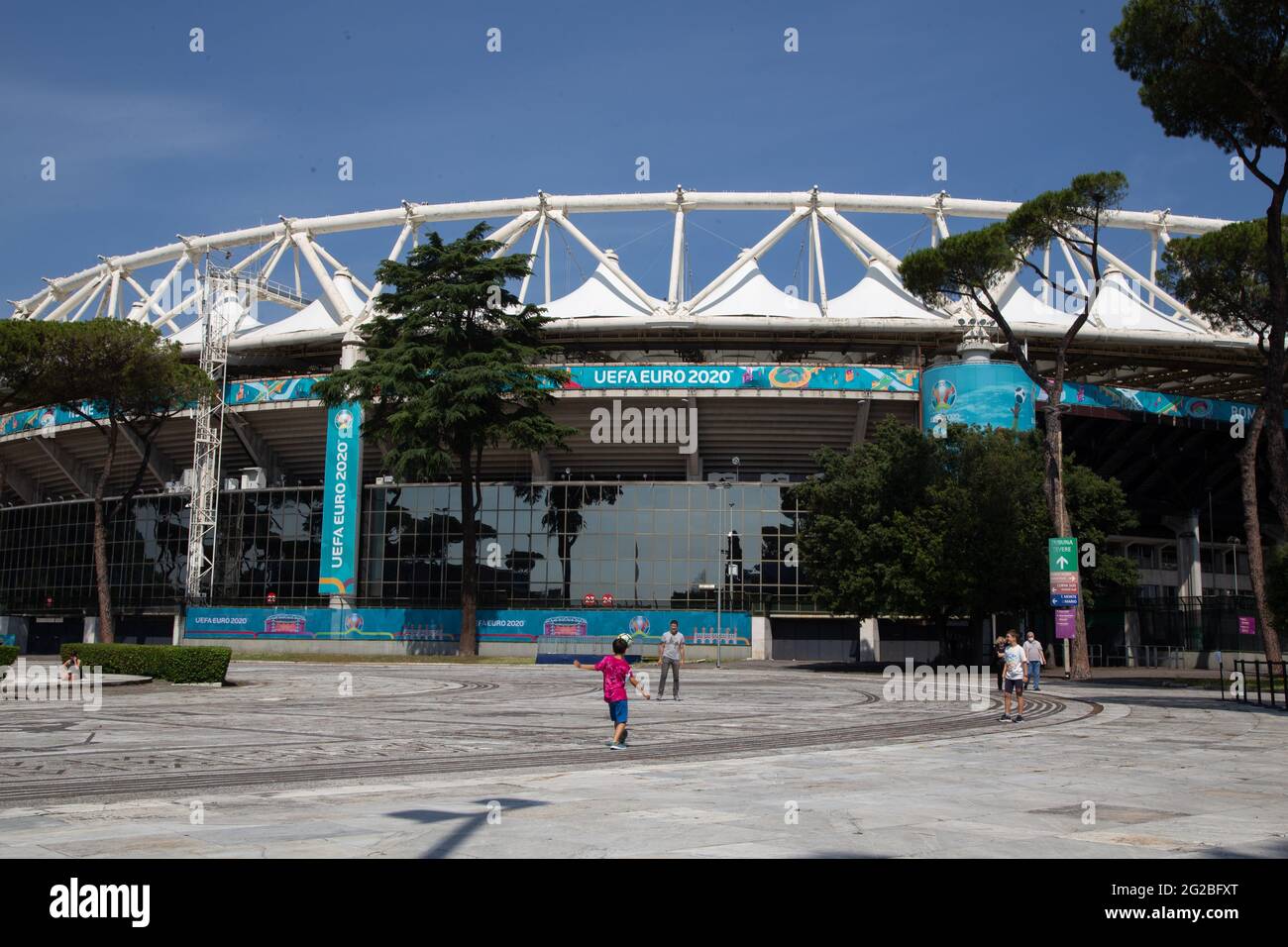 Rome, Italy. 10th June, 2021. Children play football in front of the Olympic Stadium in Rome. Olympic Stadium in Rome will host tomorrow evening, Friday 11 June 2021, inaugural match of European Football Championships, which should have been played in 2020 but, due to covid-19 pandemic, will be played this year (Photo by Matteo Nardone/Pacific Press) Credit: Pacific Press Media Production Corp./Alamy Live News Stock Photo