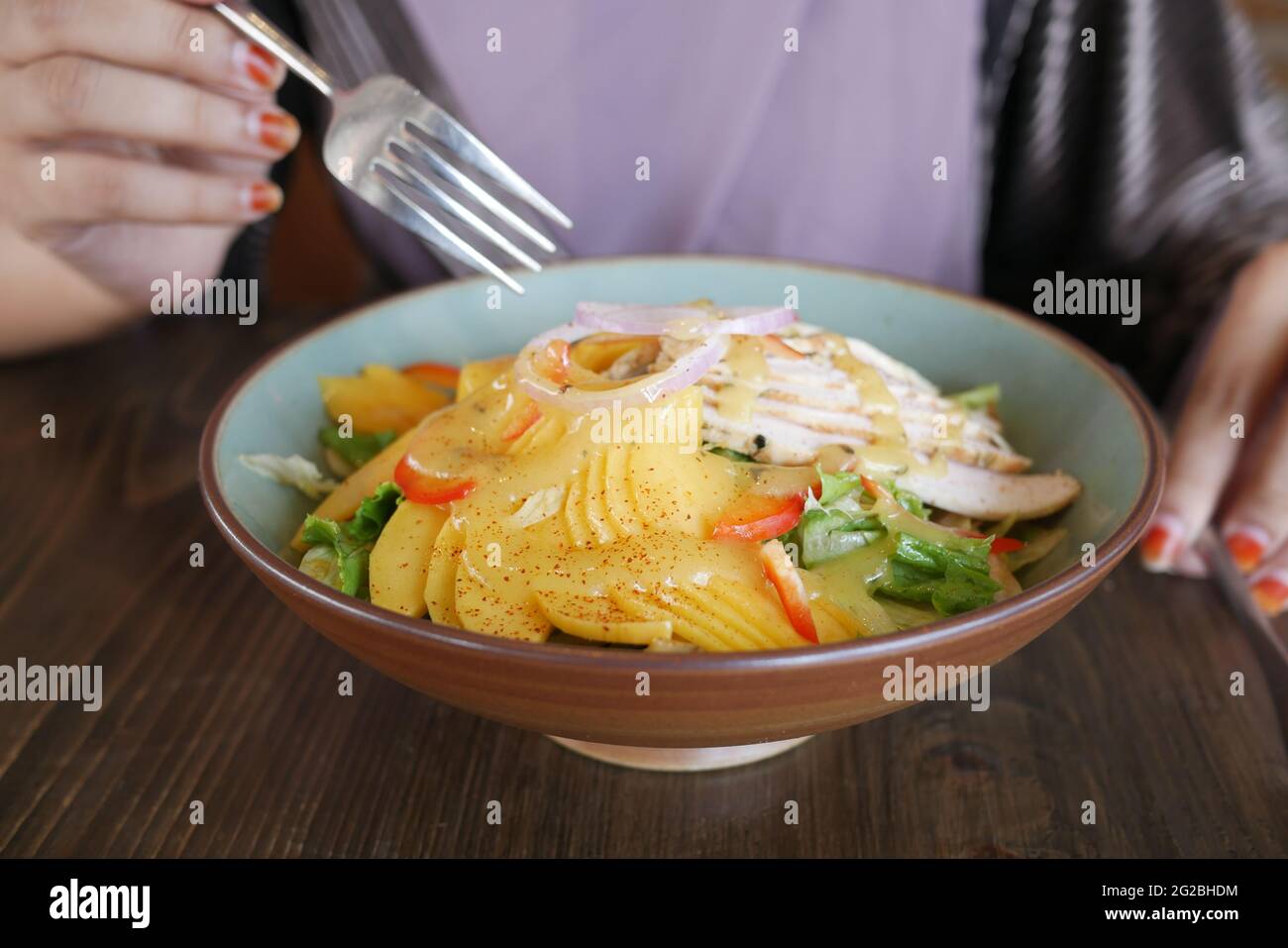 Grilled Chicken With Mango Salsa in a Bowl Stock Photo