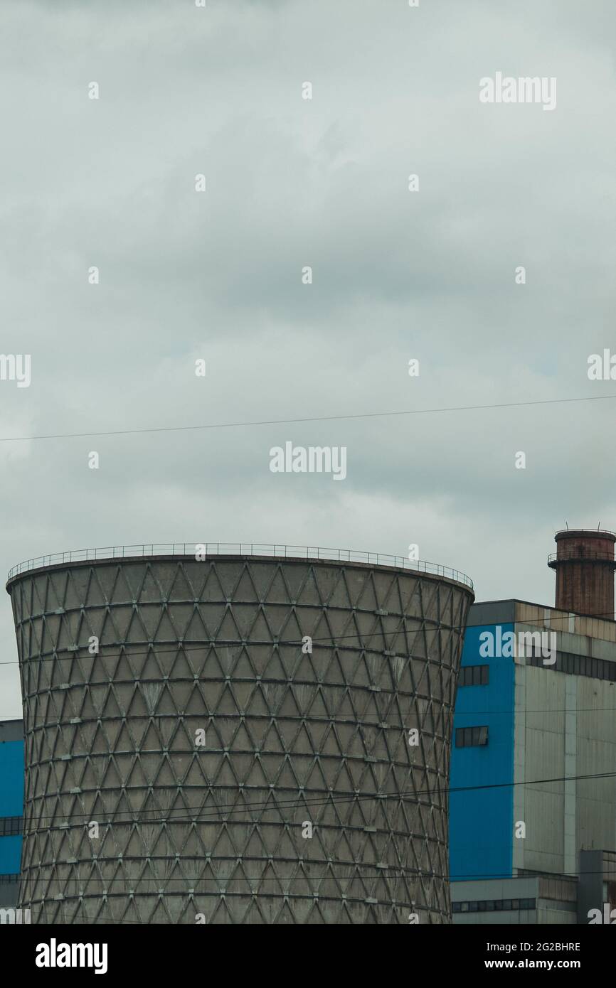 Vertical shot of a cooling tower on a cloudy d Stock Photo - Alamy
