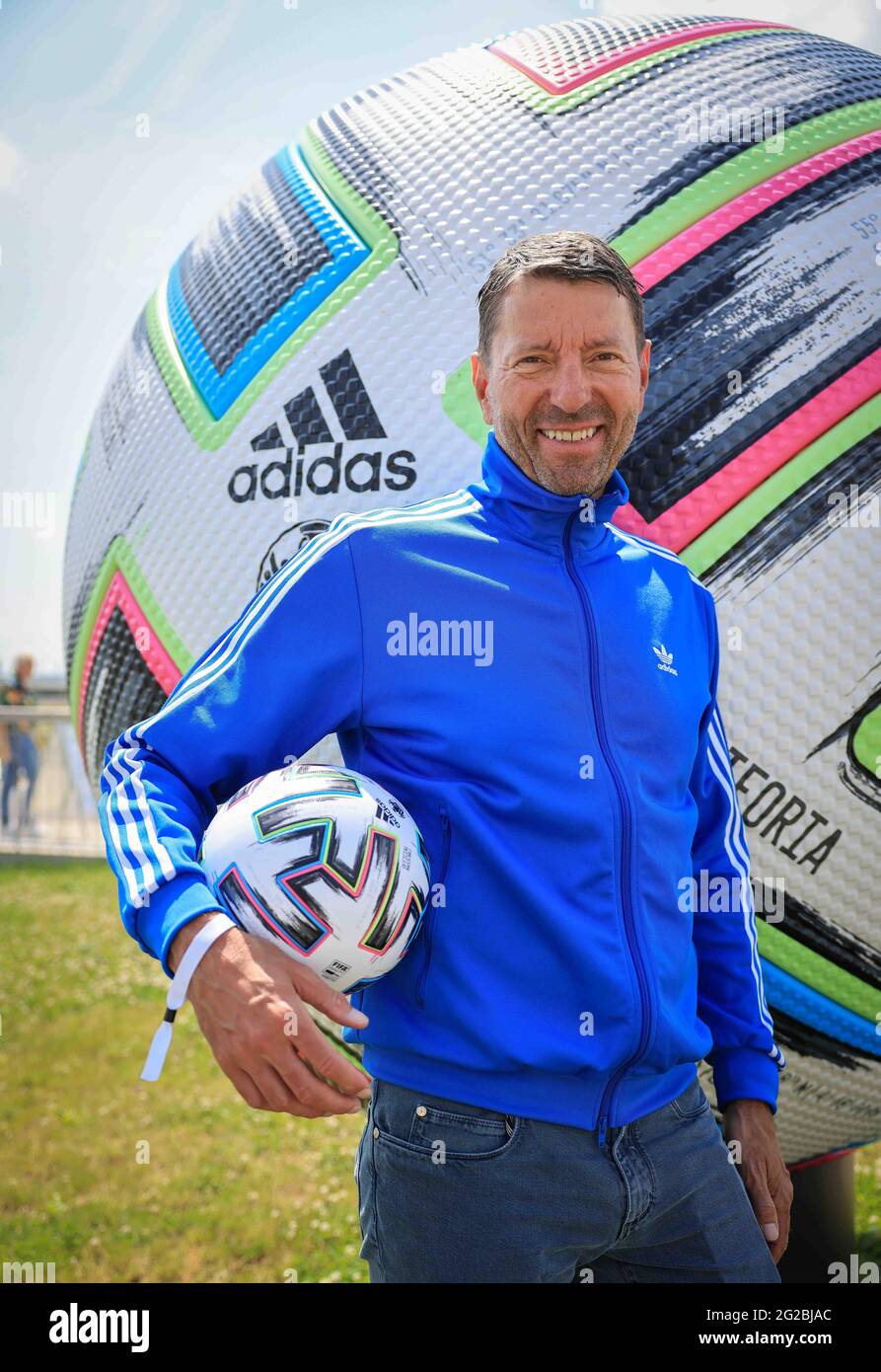 Herzogenaurach, Germany. 10th June, 2021. Kasper Rorsted, CEO of Adidas AG, stands during a brief photo session with official EURO 2020 match ball in front of the DFB media centre