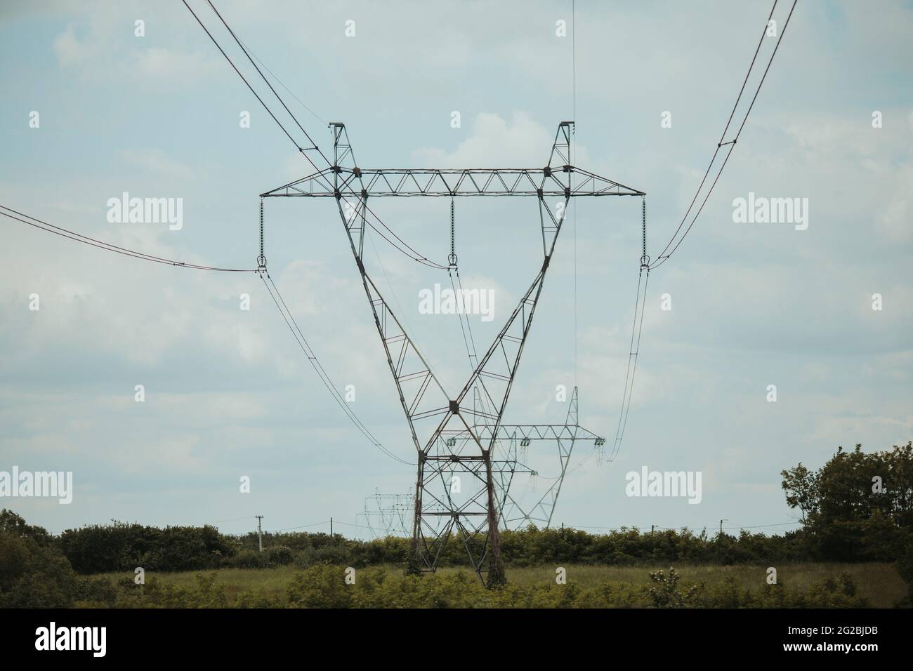Power transmission lines on a cloudy day Stock Photo - Alamy