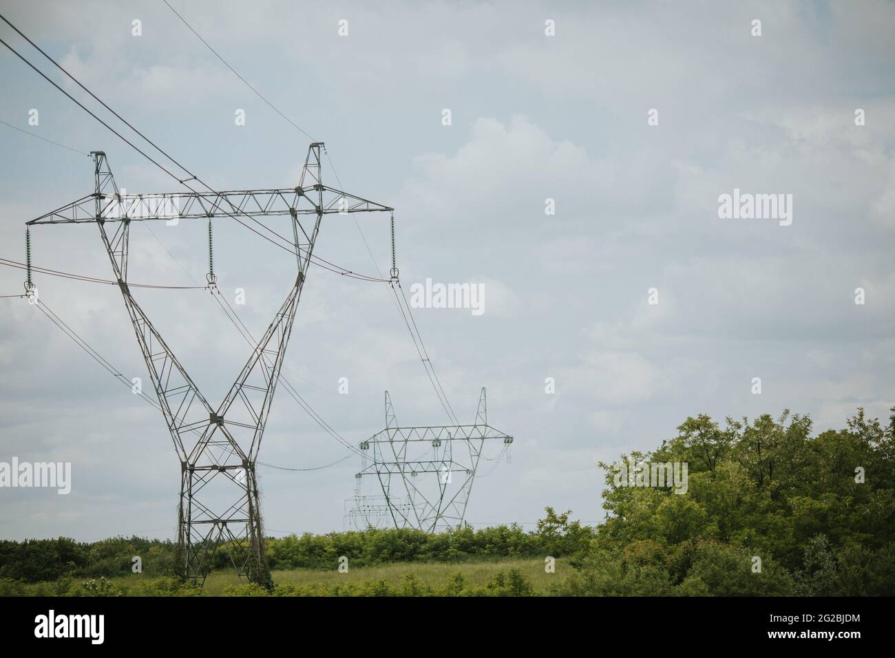 Power transmission lines on a cloudy day Stock Photo - Alamy