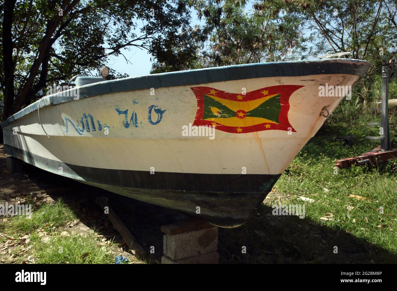 Grenada near Gouyave Grenadian Flag Painting on Boat Stock Photo