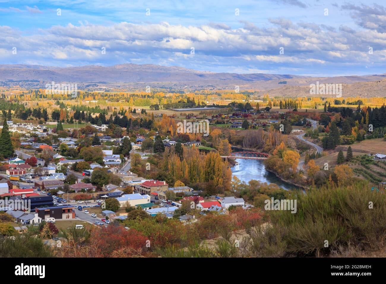 Clyde, a town in the South Island of New Zealand, in autumn. The Clutha River passes through the town at center right Stock Photo