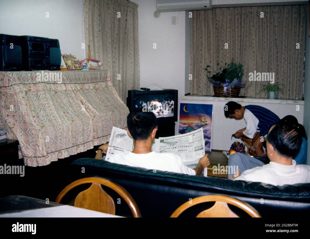 Tokyo Japan Family in living Room Watching Television Stock Photo