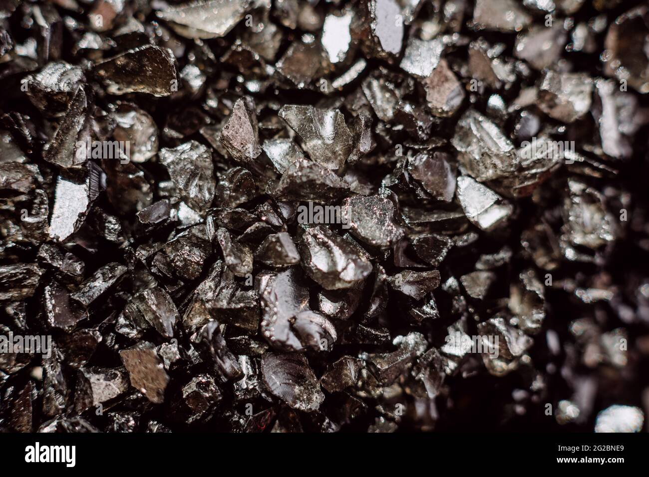 Modern industry depends on mining for the valuable rare-earth, rare earth crystal detail Stock Photo