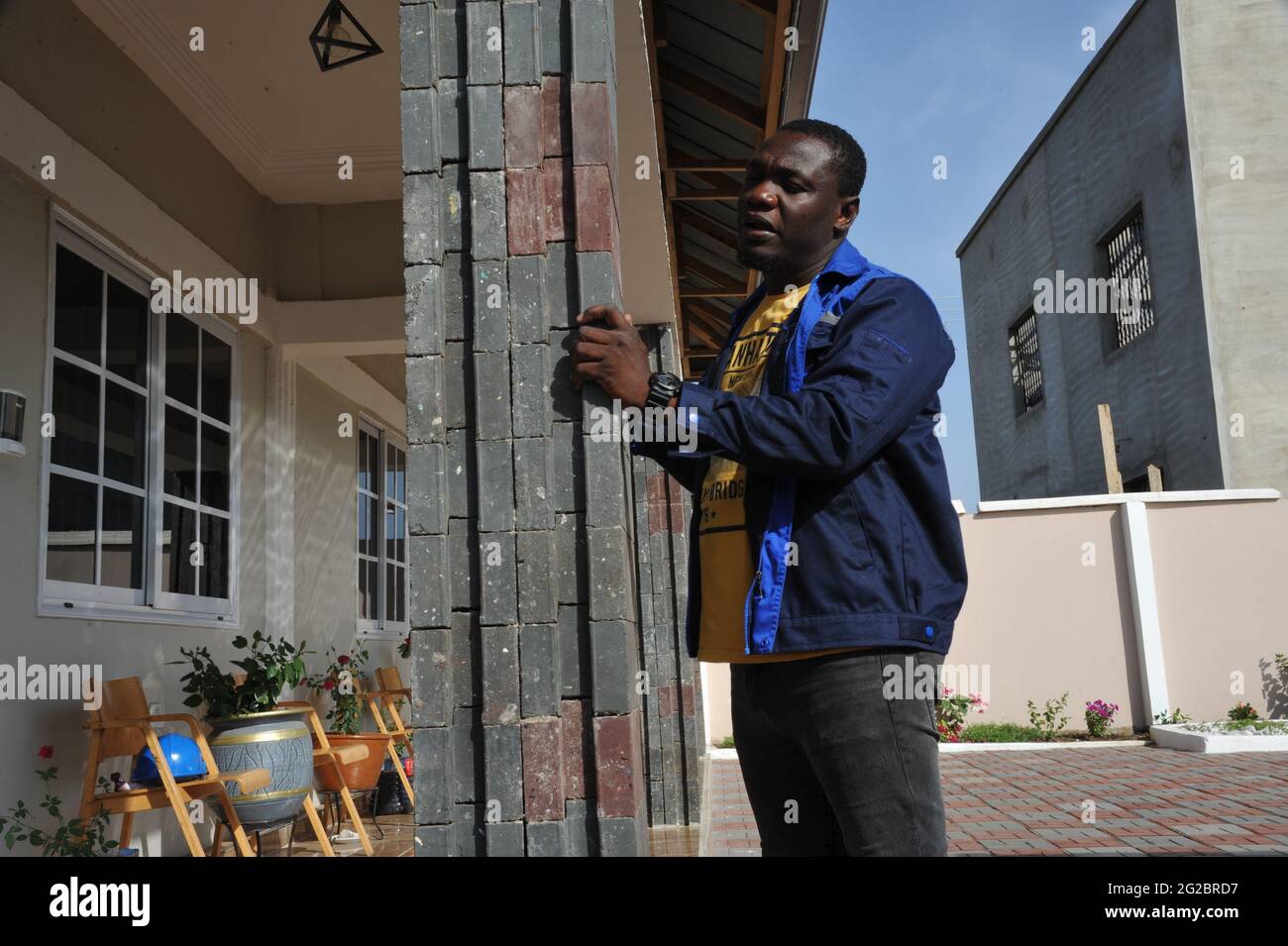 Accra, Ghana. 27th May, 2021. Nelson Boateng stands behind a designed