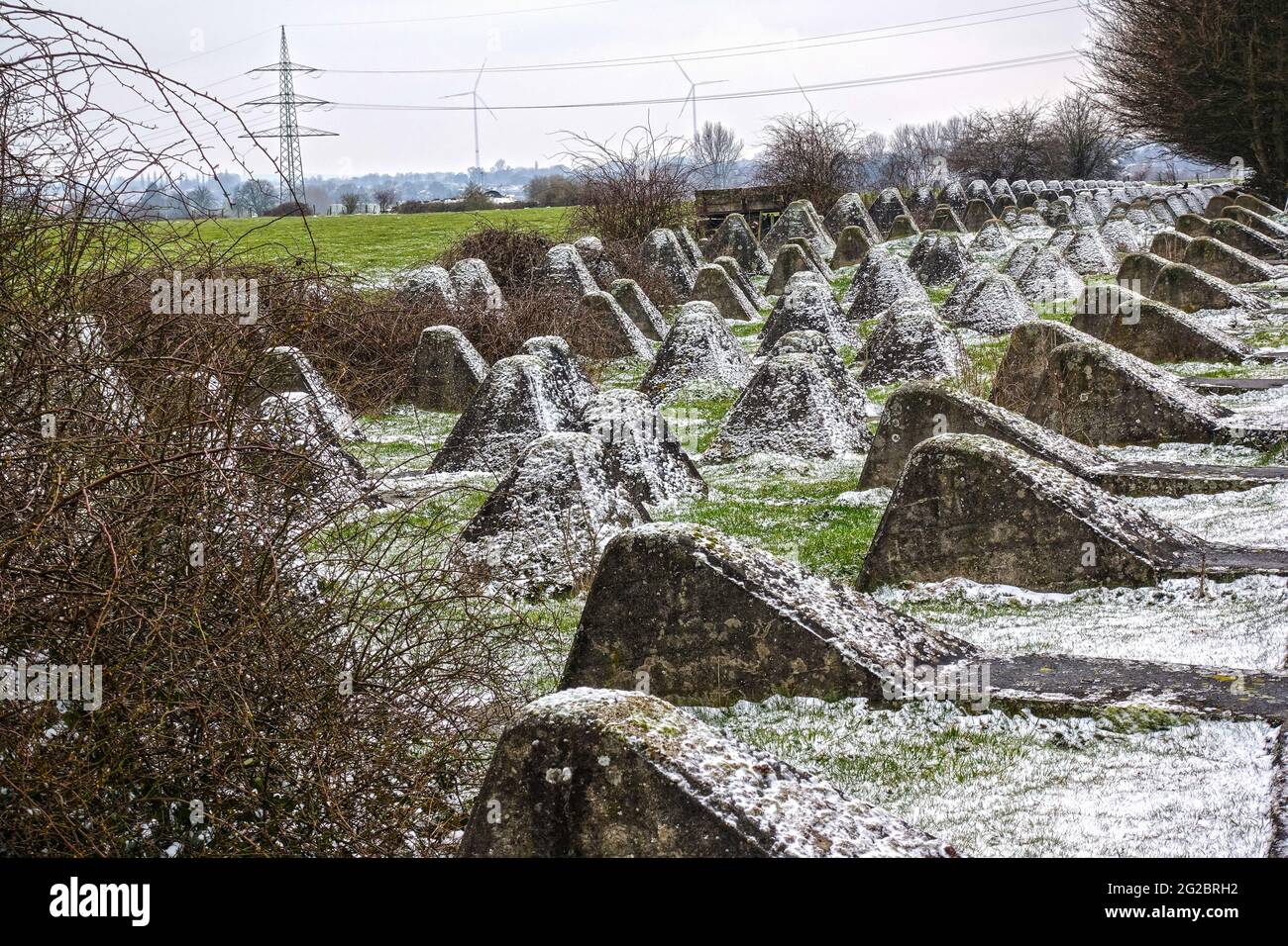 Pyramid-shaped concrete blocks, also called dragon's teeth, as part of the historic Westwall (Siegfried Line), built during World War II. by Germans t Stock Photo
