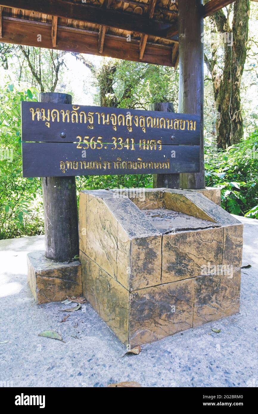 Benchmark of the highest spot in Thailand at Doi Inthanon National Park, Chiang mai, Thailand. 2,565.3341 Meters above mean sea level.(Translation:The Stock Photo