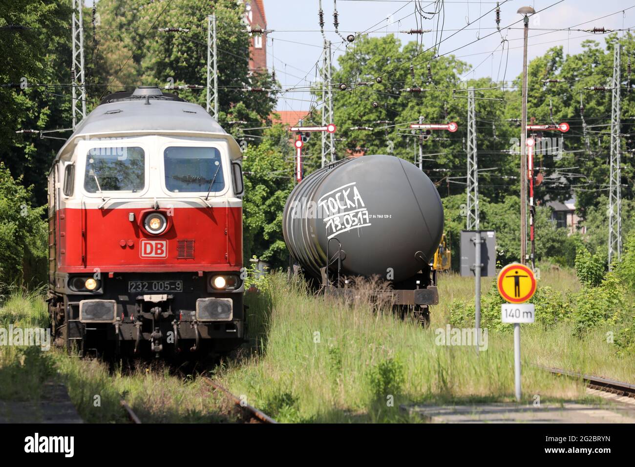 10 June 2021, Mecklenburg-Western Pomerania, Demmin: The derailed tank wagon with 80 000 litres of petrol is back on the rails after recovery. The wagon had jumped off the rails on 09.06.2021 as the last wagon of a freight train entering the station. The remaining freight train with 20 further loaded tank wagons was uncoupled and could already roll on to the south. Photo: Bernd Wüstneck/dpa-Zentralbild/dpa Stock Photo