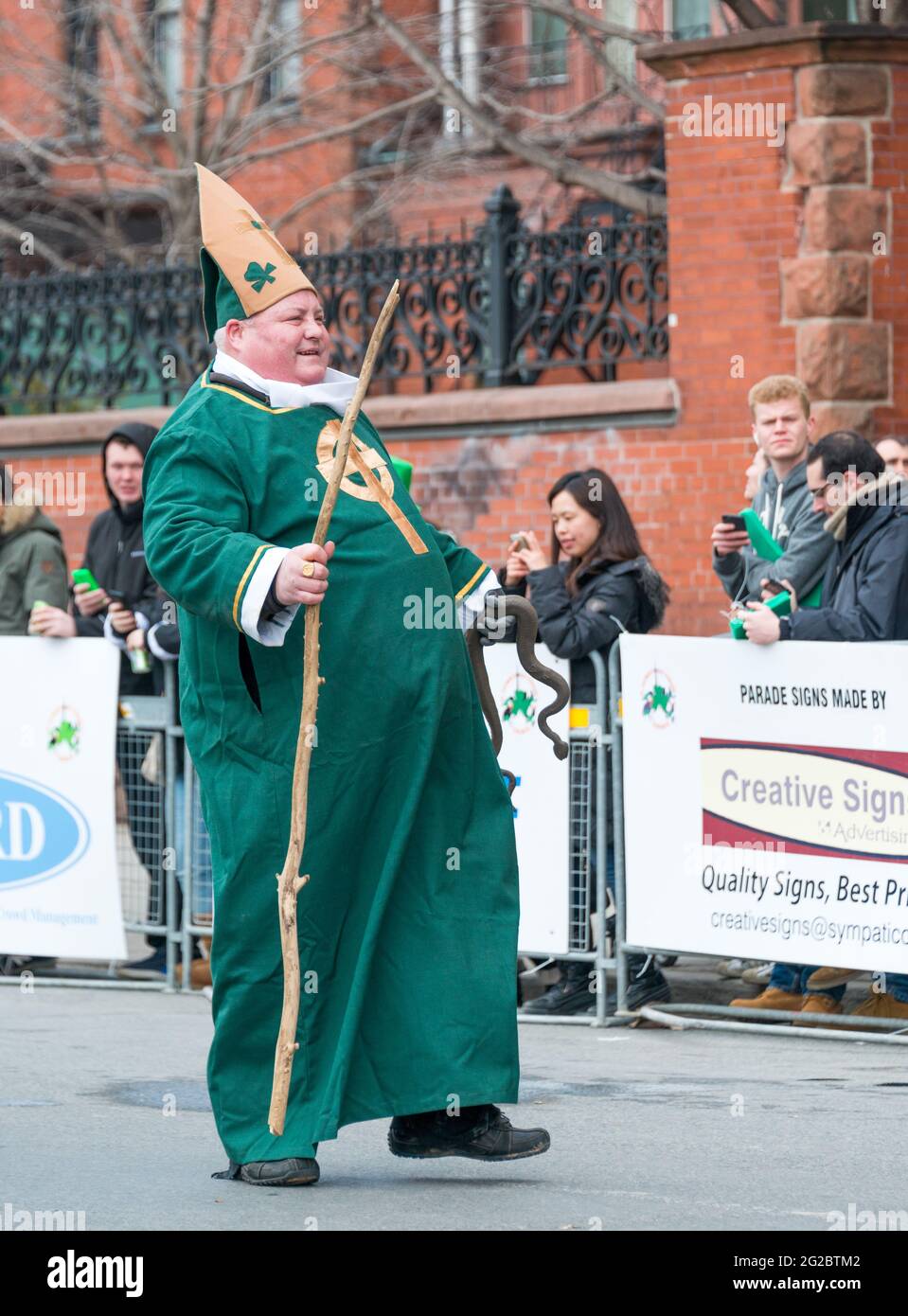 St. Patrick's Day Parade joyful participant dressed up like St. Patrick himself, multicultural Toronto enjoys the Irish culture as its own Stock Photo