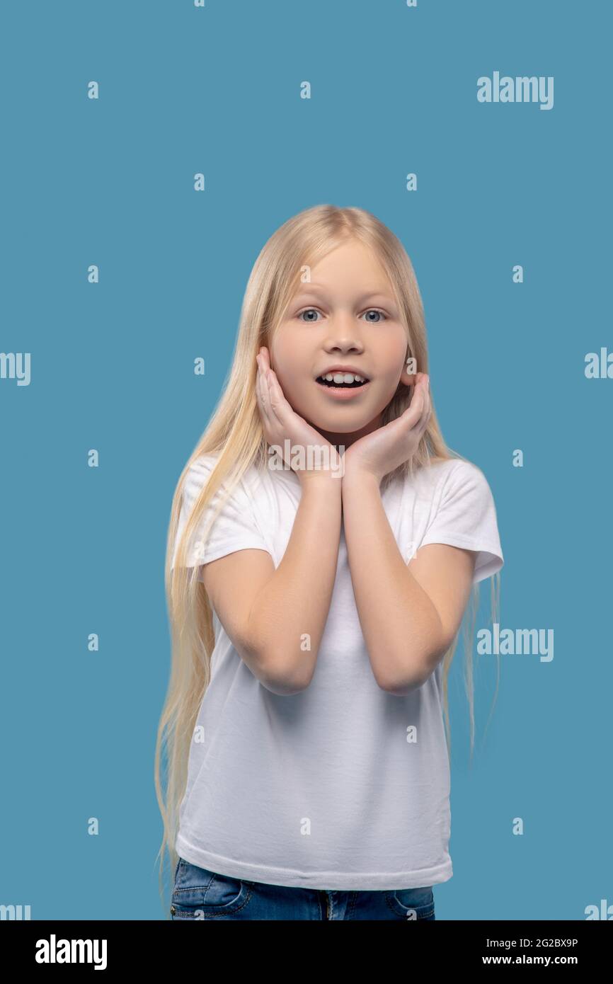 little-surprised-girl-with-hands-near-face-stock-photo-alamy