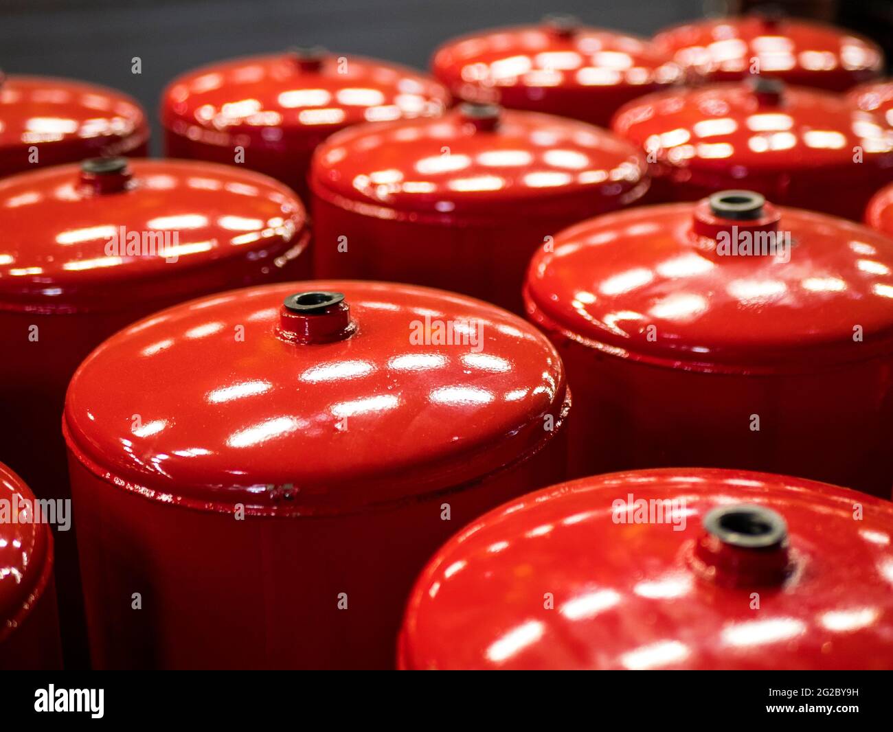 Compressed air tanks for vehicles. Air reservoirs for air suspension systems. Red tractor air tanks Stock Photo