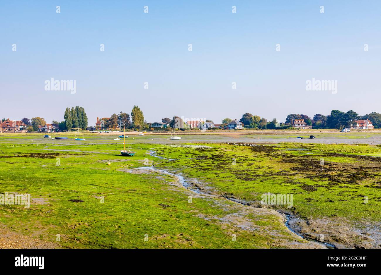 View from Shore Road of harbour mud flats and rivulets at low tide, Bosham, a coastal village on Chichester Harbour, West Sussex, south England Stock Photo