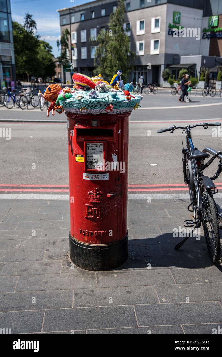 Yarn bombing on post boxes in Colliers Wood South London. Stock Photo