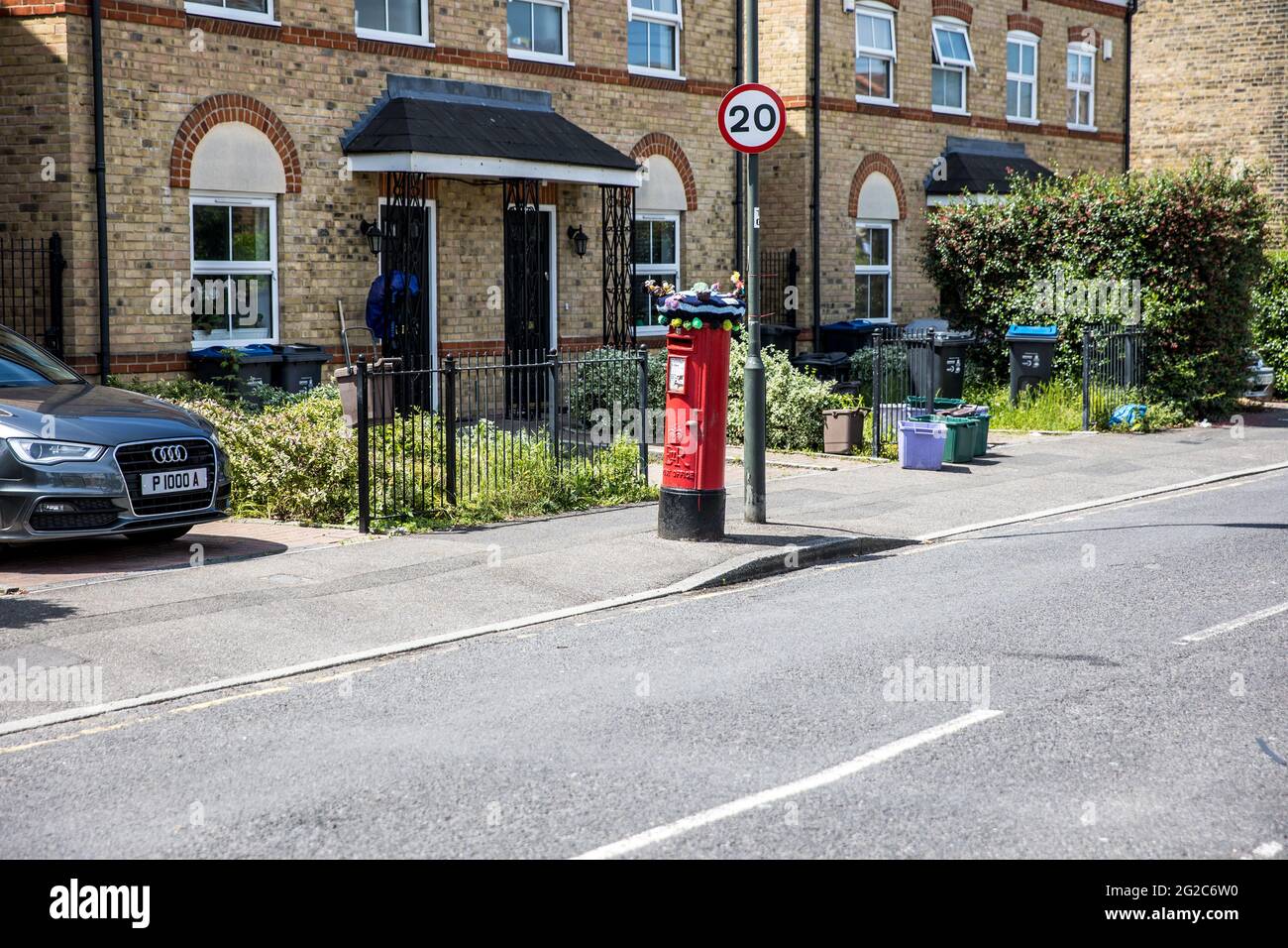 Yarn bombing on post boxes in Colliers Wood South London Stock Photo