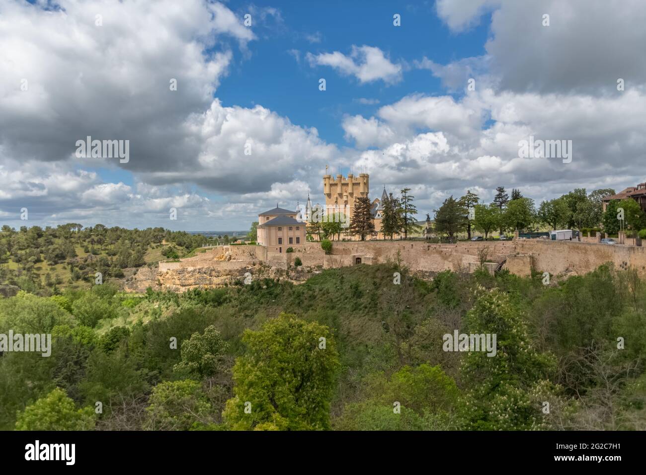 Segovia / Spain - 05 13 2021: Majestic view at the iconic spanish medieval castle palace Alcázar of Segovia, towers and domes, fortress and surroundin Stock Photo