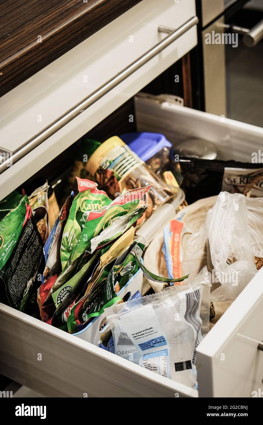 POZNAN, POLAND - Dec 30, 2015: Open messy drawer in a domestic kitchen Stock Photo