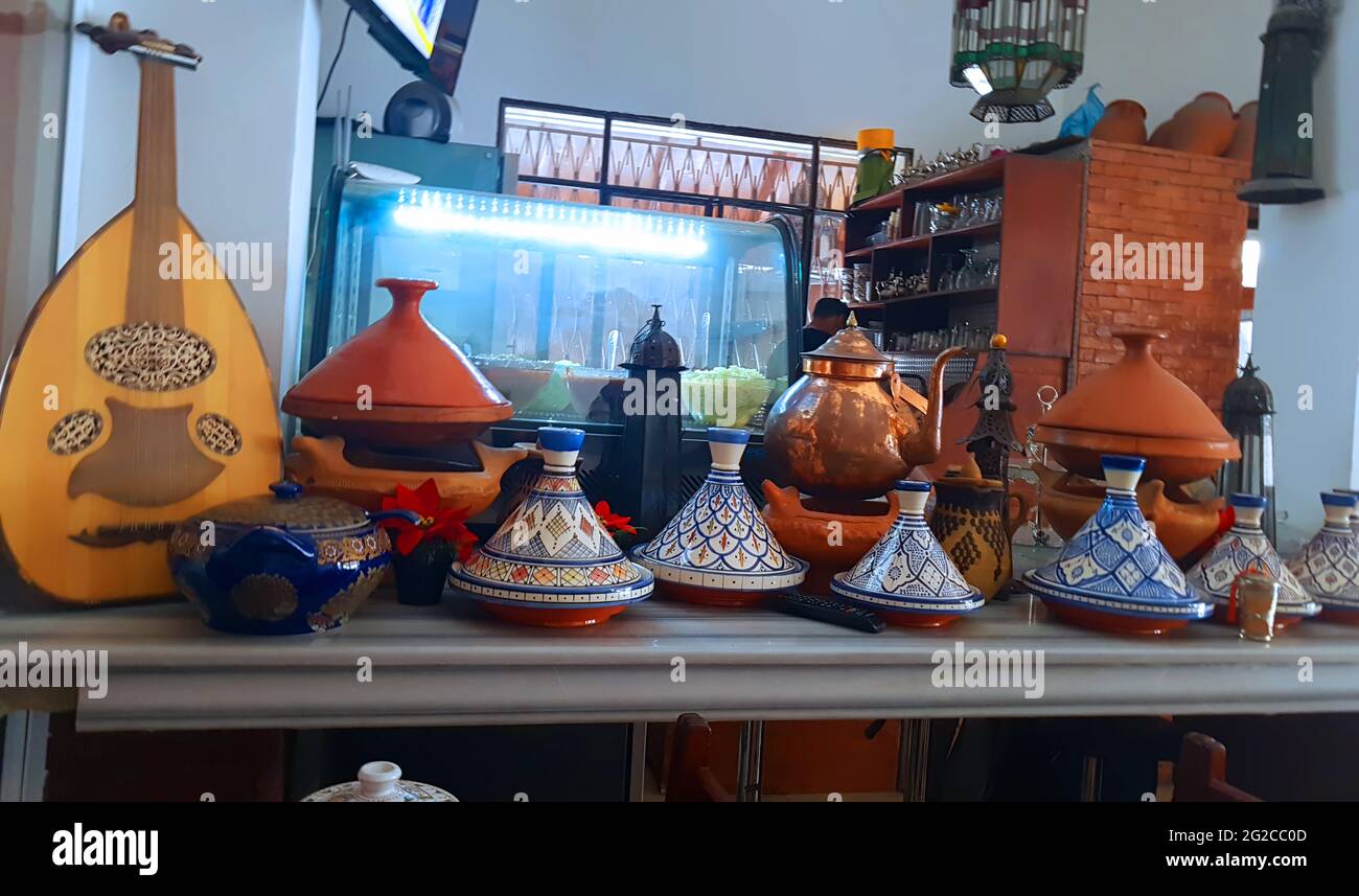 Authentic Moroccan tagine table setting.Front of a Moroccan restaurant Stock Photo