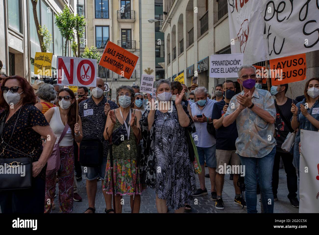 Madrid, Spain. 10th June, 2021. Protesters marching with placards while shouting slogans during the demonstration.A group of protesters gathered outside the Ministry of Health to demonstrate against the closures of health centres and primary care services. Credit: SOPA Images Limited/Alamy Live News Stock Photo