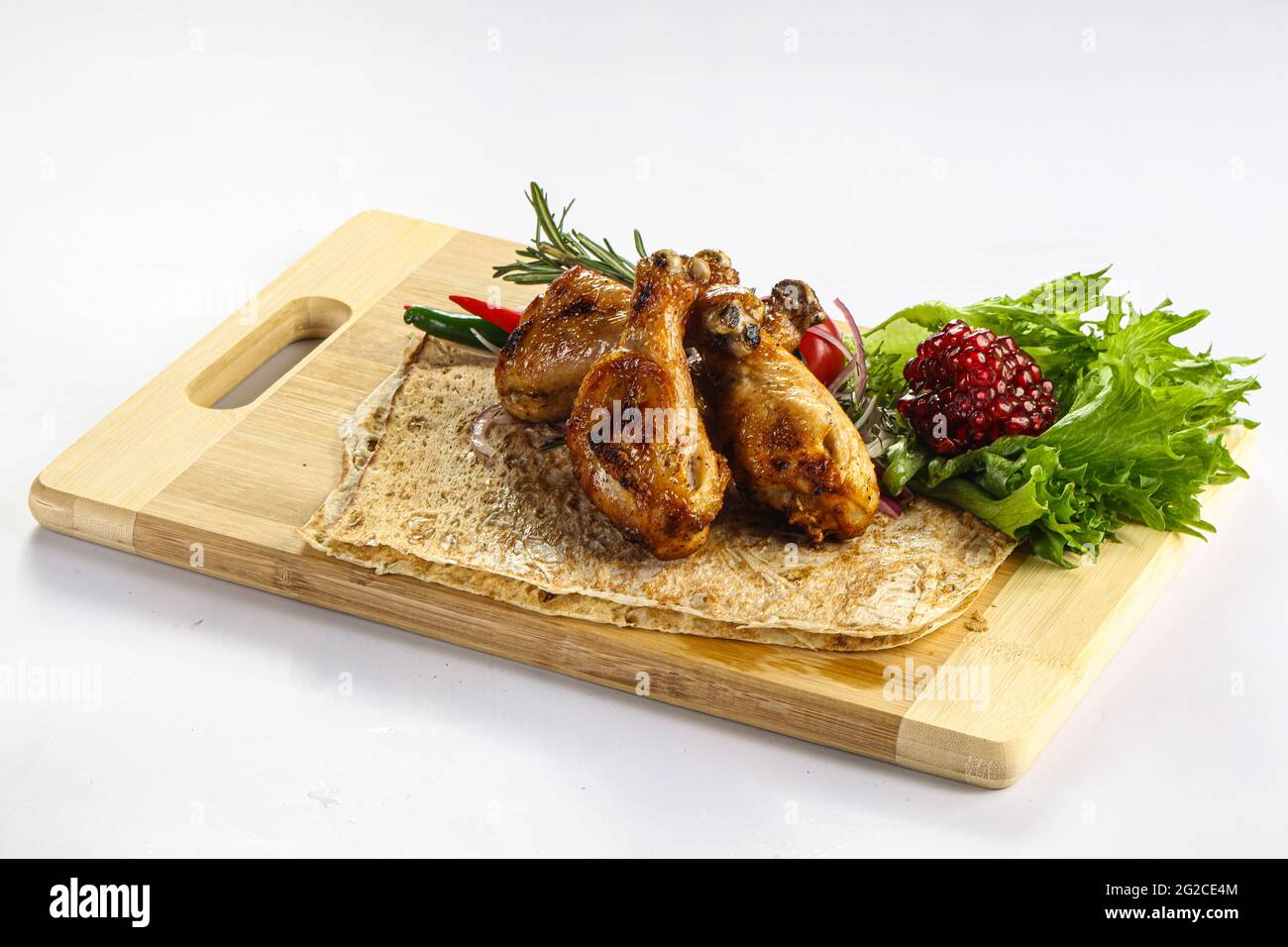 Grilled Chicken drumstick barbecue shashlik served rosemary Stock Photo