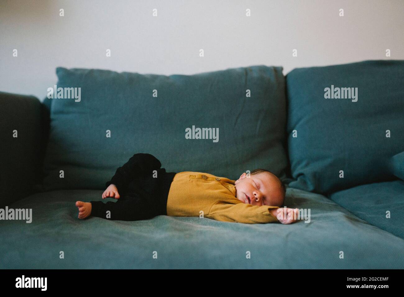 Baby sleeping on sofa Stock Photo Alamy