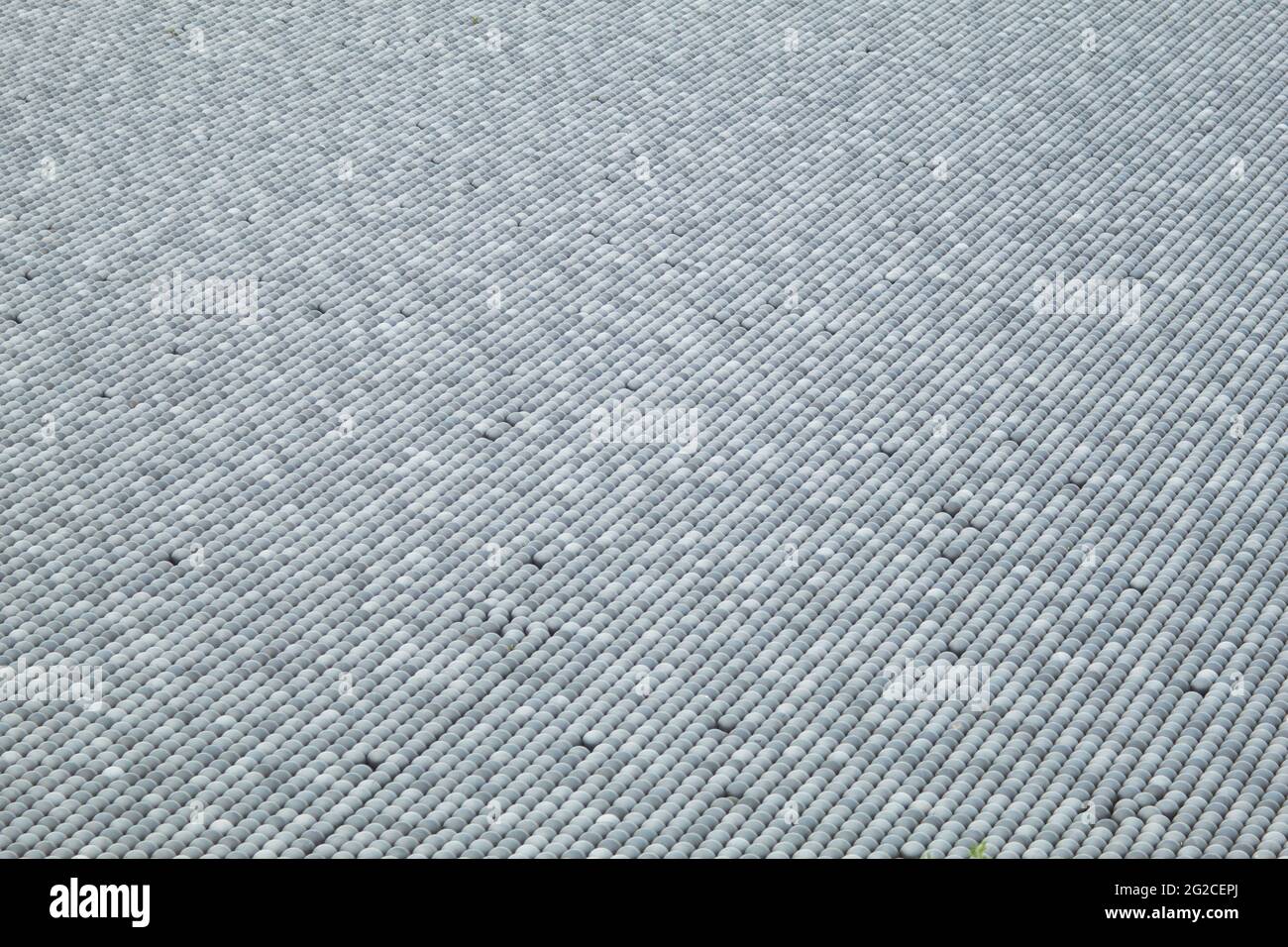 Black plastic balls for filling reservoirs. Shadow balls are small