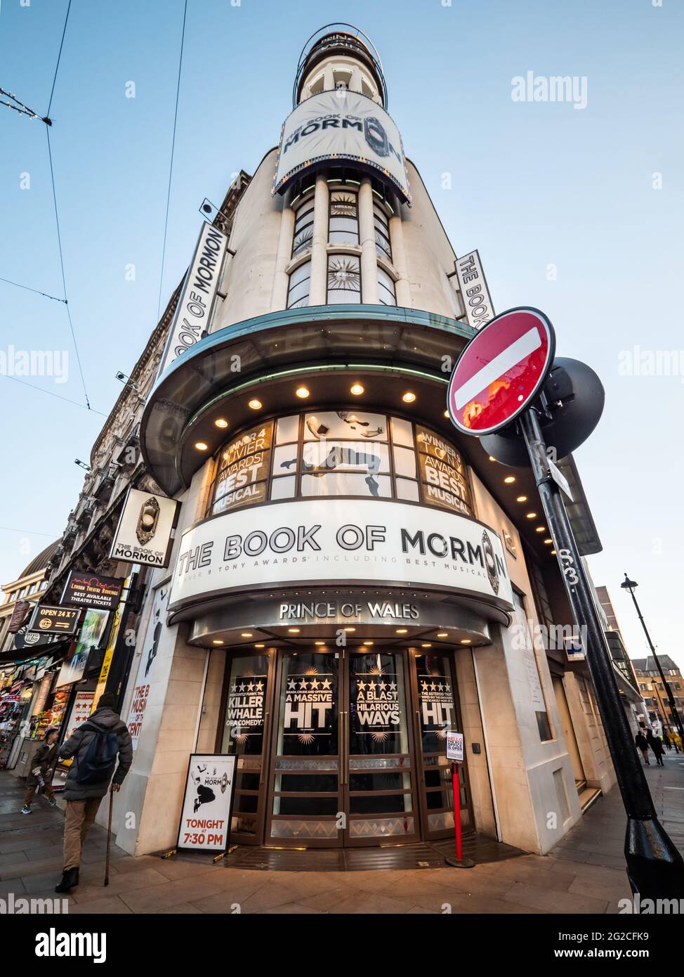 The Prince of Wales Theatre, West End, London. Low, wide angle view of the façade to the venue showing the play 'The Book of Mormon'. Stock Photo