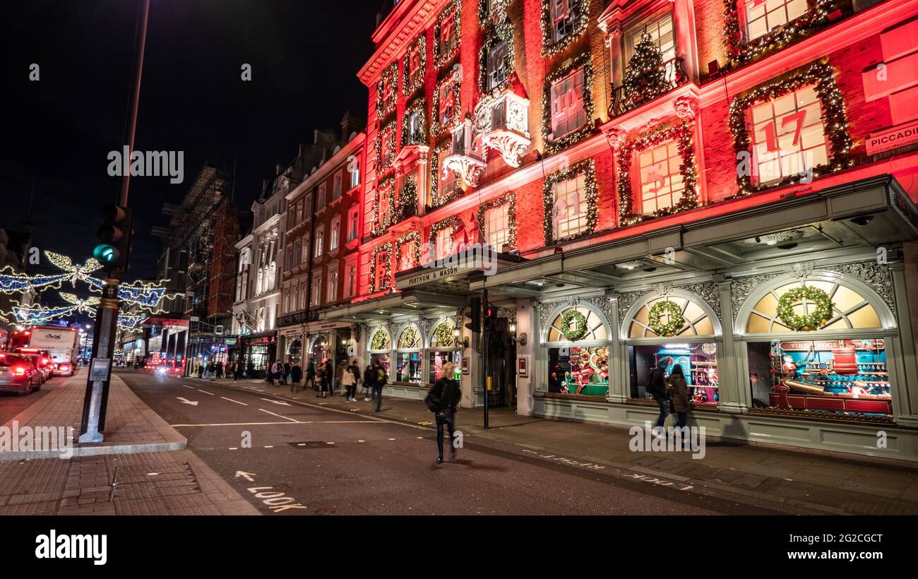 Fortnum & Mason, Piccadilly, London. The façade to the exclusive department store decorated and illuminated at night as a Christmas advent calendar. Stock Photo