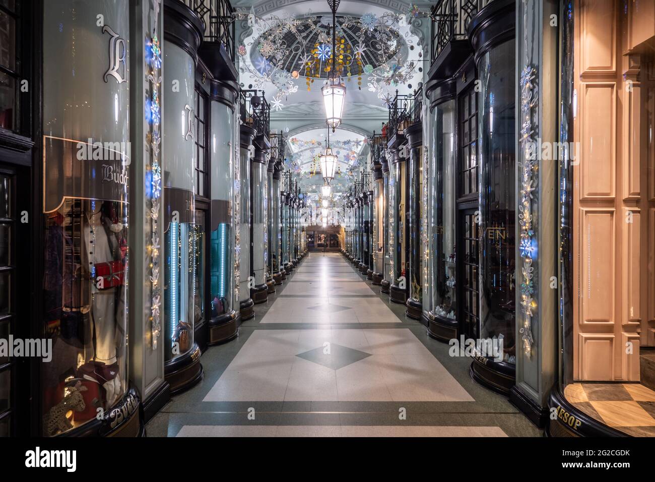 Piccadilly Arcade, London. A rare empty view without shoppers of the exclusive shopping arcade in central London decorated for the Christmas season. Stock Photo