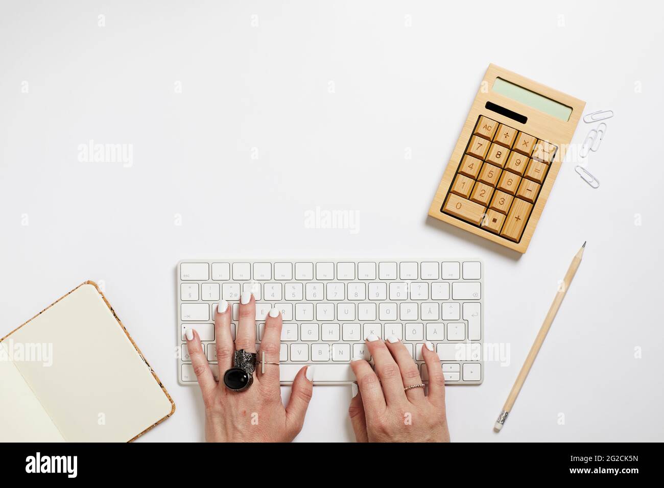 Various items on white desk Stock Photo