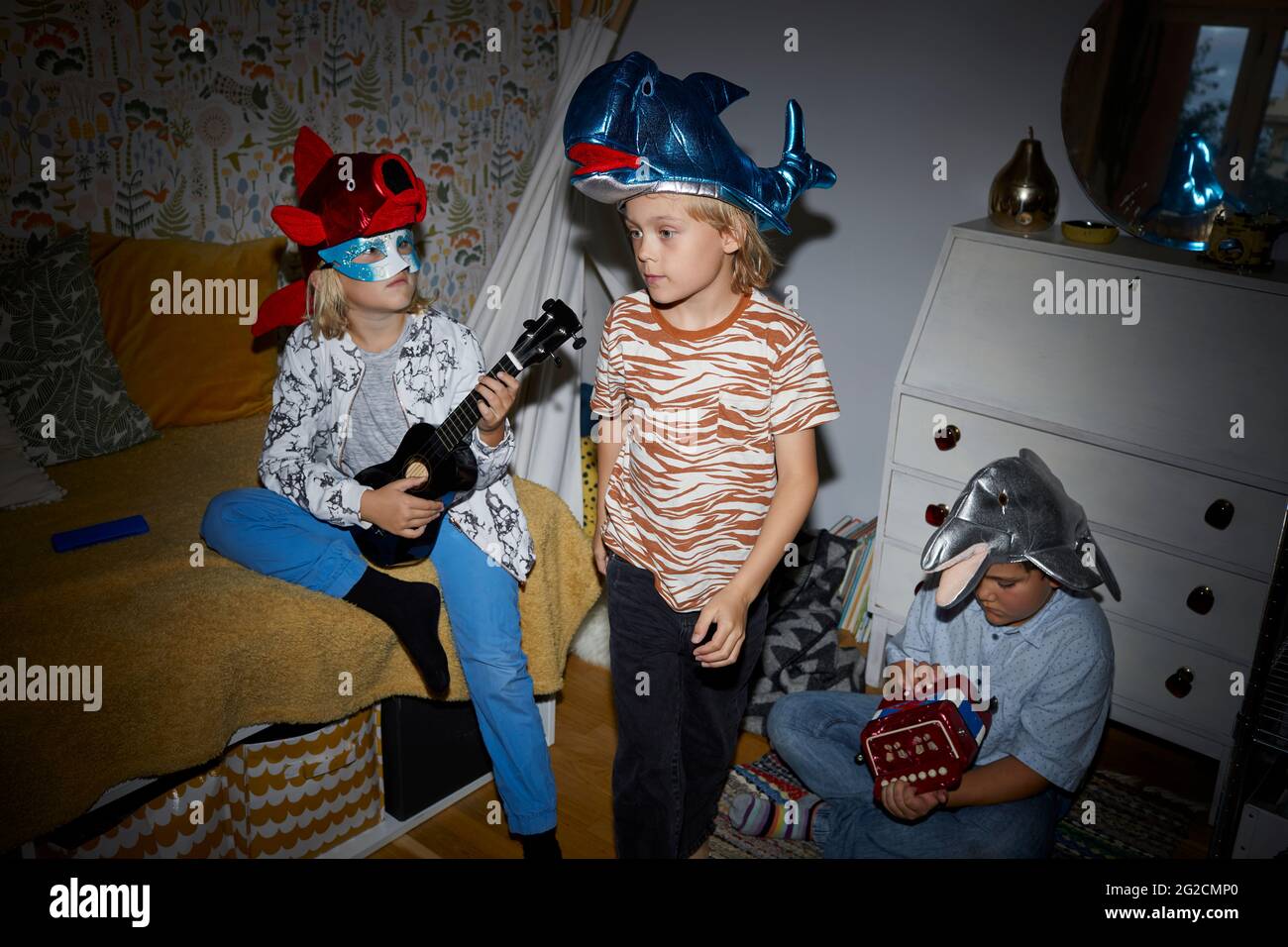 Children playing in bedroom Stock Photo